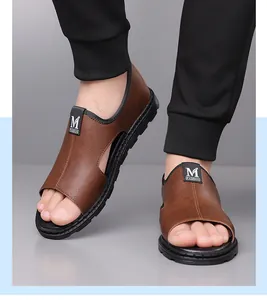 Detailed shot of men's brown leather Roman sandals with open toe and soft black sole