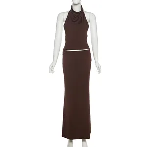 Sleek brown halter neck top and matching slim fit maxi skirt set on a mannequin.