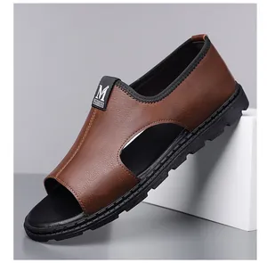 Side view detail of brown textured leather men's Roman sandal with breathable cutouts