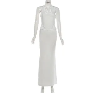 Elegant white halter neck camisole and slim fit maxi skirt two-piece set for women