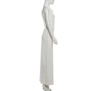 Side view of elegant white halter top and maxi skirt set for women on white mannequin