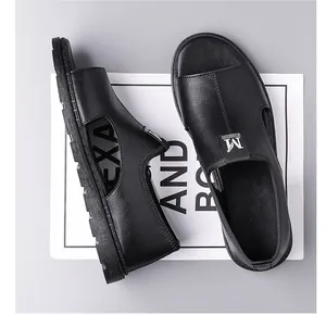 Detailed macro view of black leather men's Roman sandals with breathable cutouts.