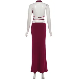 Back view of sexy burgundy halter backless top and slim maxi skirt set for women.