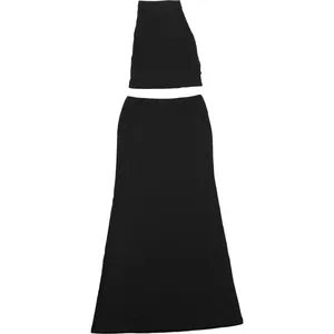 Close-up of a black two-piece set featuring a halter top and a slim-fit maxi skirt.