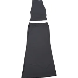 Detail view of a two-piece halter neck crop top and slim fit maxi skirt set in dark gray