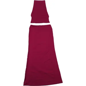 Detail of burgundy two-piece set featuring halter crop top and matching slim maxi skirt.