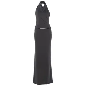 Full view of black halter neck top and matching slim fit maxi skirt two-piece set