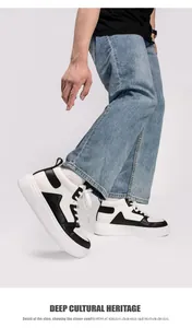 Side view of men's black and white mid-top platform sneakers in a walking pose.