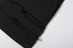 Close-up detail of adjustable shoulder straps on black sexy backless camisole top