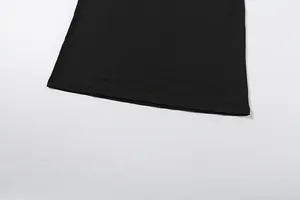 Close-up detail of the hemline and fine stitching on a black bodycon mini skirt