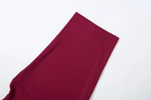 Detailed close-up view of the premium burgundy fabric and stitching for the slim skirt