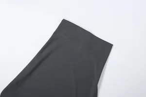 High-quality detail of smooth charcoal gray fabric texture for women's skirt set.