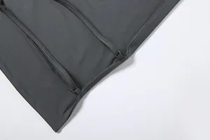 Close-up detail of the fine stitching and adjustable straps on dark grey camisole