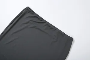 Detailed view of the elastic waistband and fine stitching on a charcoal grey pencil skirt