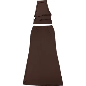 Chic brown two-piece set featuring backless halter neck top and slim fit maxi skirt.