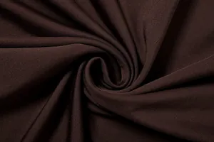 High-quality macro view showing the smooth texture of dark brown ribbed stretch fabric