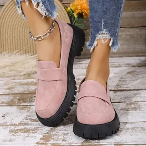 Stylish pink suede loafers with chunky black lug soles and slip-on design for women