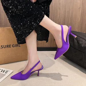 Elegant purple satin pointed-toe slingback kitten heels with a stylish mid-heel design.