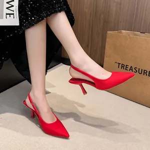 Detailed close-up view showing the elegant red pointed-toe slingback high heels for women.