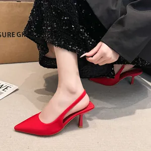 Elegant red pointed-toe slingback high heels with a stylish stiletto heel design.