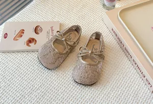 Elegant children's lace mesh Mary Jane shoes with bow detail for spring summer season