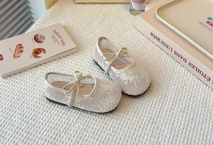 Detail view of breathable lace mesh Mary Jane flats for girls with bow detail