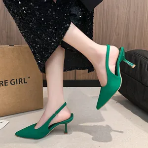 Elegant green pointed-toe slingback kitten heels for women, stylish side view on model