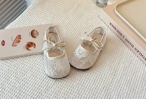 Toddler girl floral lace Mary Jane shoes with bow tie detail for summer.