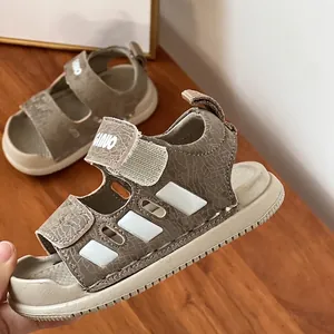 Close-up of brown toddler sandals with crackle texture and soft sole