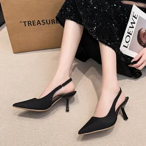Elegant black pointed-toe slingback stiletto heels for women in a stylish setting