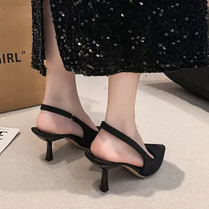Elegant black pointed toe slingback heels with slim kitten heels for a stylish look