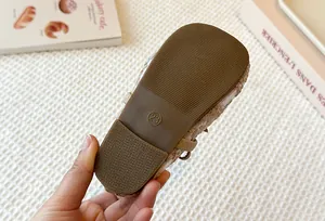 Detailed macro shot of toddler girls Mary Jane shoe brown rubber sole size 23