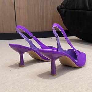 Detail view of elegant purple slingback kitten heels with pointed toe