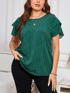 Green blouse with black irregular polka dot print and ruffled layered sleeve details