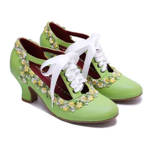 Close-up of vintage green leather Mary Jane heels with floral lace and white ribbon