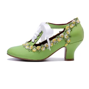 Close-up view of a green vintage Mary Jane high heel with floral lace and white ribbon tie