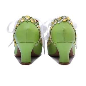 Back view of handmade green leather Mary Jane heels with floral lace and ribbons