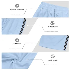 Détails du short de sport bleu clair pour homme avec rayures latérales et texture
