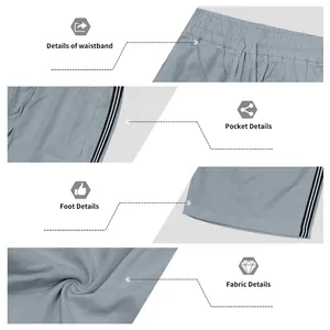 Détails de shorts de sport à séchage rapide avec cordon et bandes latérales.