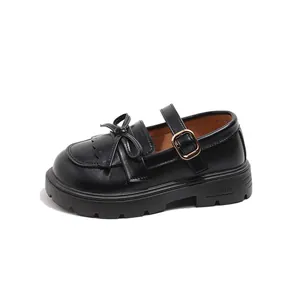 Retro British style chunky platform Mary Jane shoes for women with bow detail in black.