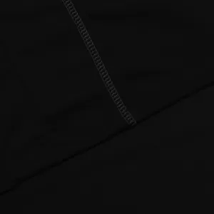 Macro detail of high-quality flatlock stitching on black quick-dry sports fabric