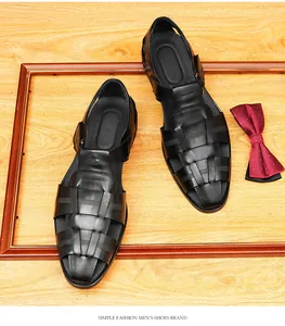 Top-down view of black woven leather closed-toe men's sandals with stylish props