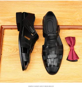 High-quality black leather woven men's sandals displayed with a classic red bow tie accessory