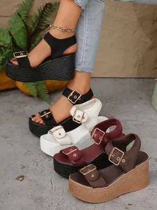 Detailed view of fashion platform wedge sandals in black white burgundy and brown colors