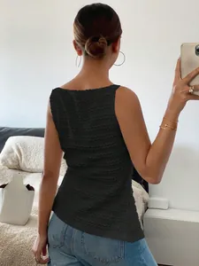 Detailed back view of the black sleeveless top featuring a unique wavy textured fabric.