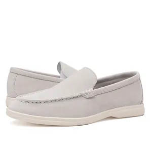 Classic men's light grey suede loafers featuring comfortable white rubber soles for daily wear