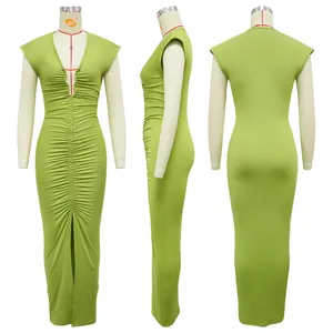 Detailed view of a lime green V-neck ruched maxi dress with front slit on mannequin