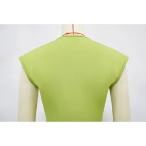 Back view detail of a lime green sleeveless slim-fit dress on a mannequin