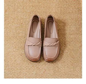 Top view of comfortable soft leather slip-on loafers with braided strap detail