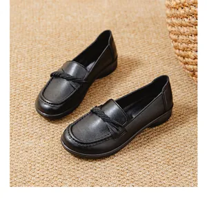 Detailed view of comfortable black slip-on loafers with soft soles and twisted strap